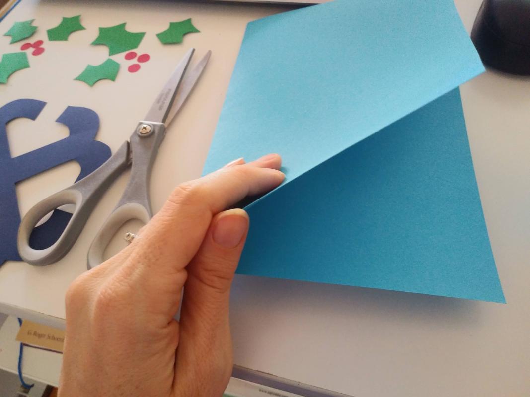 folding blue paper