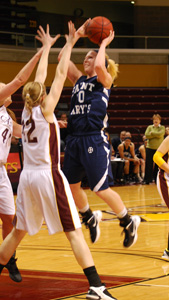 Jessica Centa goes up against two Calvin defenders in the MIAA Semifinal game on Thursday.