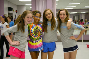 From lefft: Grace Haughey, Sarah Bogan, Jessica Ebert, and Isabelle Glavin take a break after working on a dance rourtine at Fine Arts Camp.