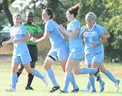 Emily Rompola (second from left) celebrates her second goal.