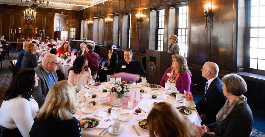 Faculty seated at awards luncheon