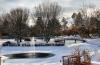 View of icy Lake Marian from Haggar Hall in the winter.