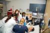 Students demonstrate their technical training on one of the high-fidelity medical mannequins.