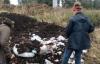 students add to compost pile