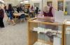 A Sister of the Holy Cross is looking at the artifacts on display