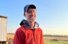 Matthew Insley smiles on the farm