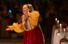 woman dressed in medieval clothing acting in a play